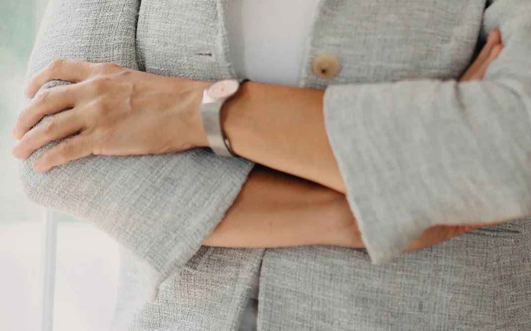 Petite work clothes under $50 — woman in a gray blazer at work