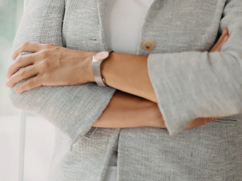 Petite work clothes under $50 — woman in a gray blazer at work
